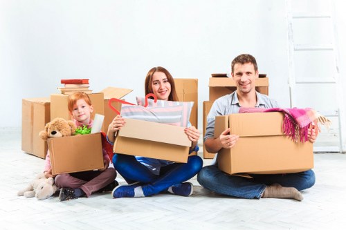 Professional movers loading furniture into a moving truck in South Kensington
