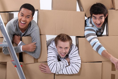 Office removals planning in South Kensington with moving boxes and workspace setup