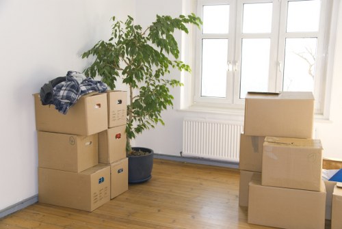Furniture pick-up service removing a sofa in Southkensington