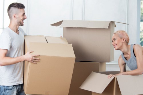 Removal team handling furniture and boxes during a flat move