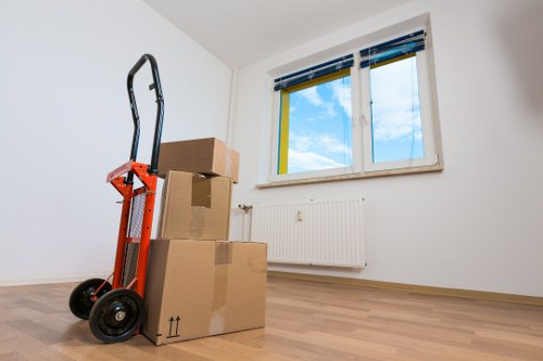 Expert movers handling fragile items during packing services in South Kensington