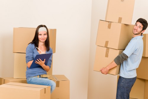 Organized student move with boxes and furniture in Southkensington