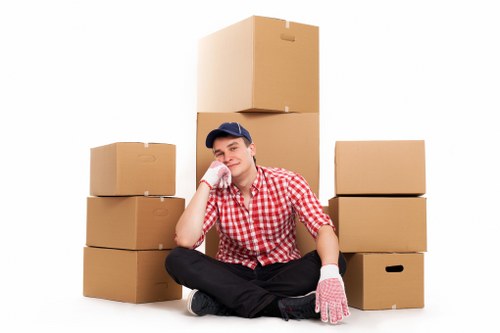 Professional movers loading boxes into a removal van in South Kensington